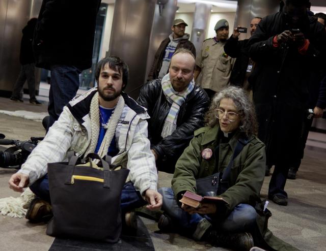 Evening prayer during a sit-in at Metro Hall, asking for an emergency cold shelter